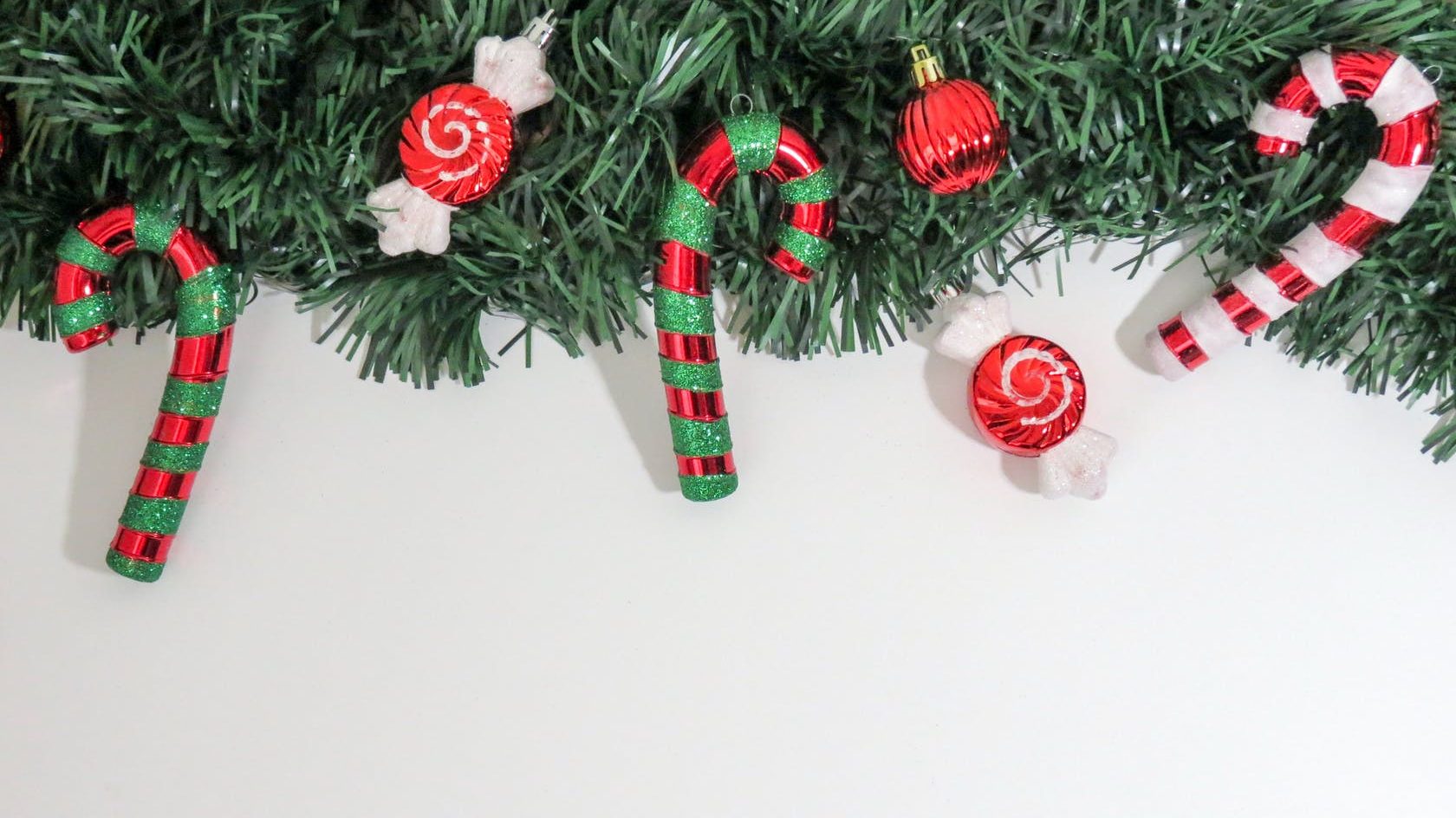 close up of christmas decorations hanging on tree